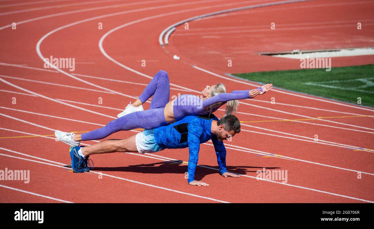 Fitness couple training together stadium hi-res stock photography and ...