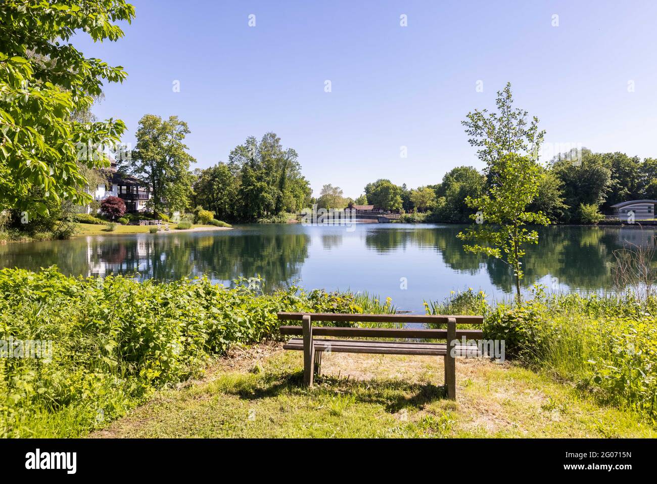 Kehl, Germany. 01st June, 2021. A park bench stands on the shore of the  Goldscheuer bathing lake. The European Environment Agency EEA comments on  the water quality in Germanys lakes, rivers and