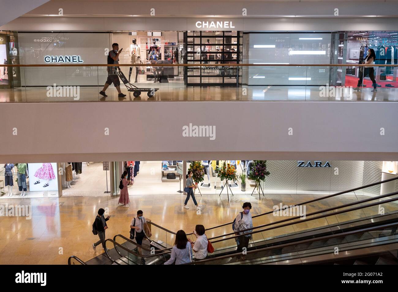 Shoppers are seen at the French multinational clothing and beauty products  brand Chanel and Spanish multinational clothing design retail company by  Inditex, Zara stores in Hong Kong Stock Photo - Alamy