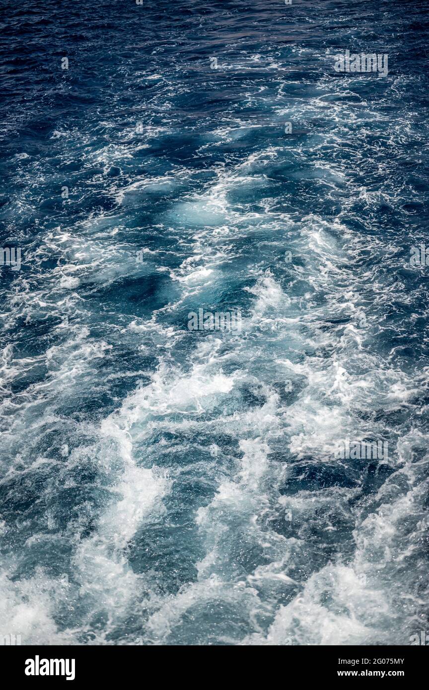 bstract of surface blue water. Abstract of surface blue water reflected with sunlight for background. Blue sea. Blue water. Water splashed use for gra Stock Photo