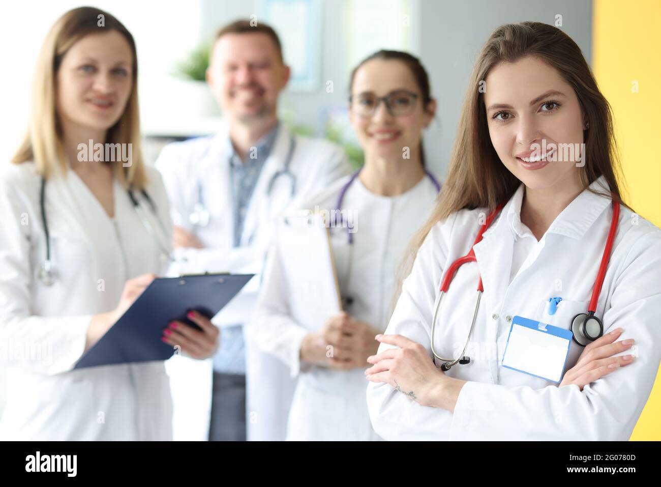 Medical doctors in white coats stand together Stock Photo Alamy
