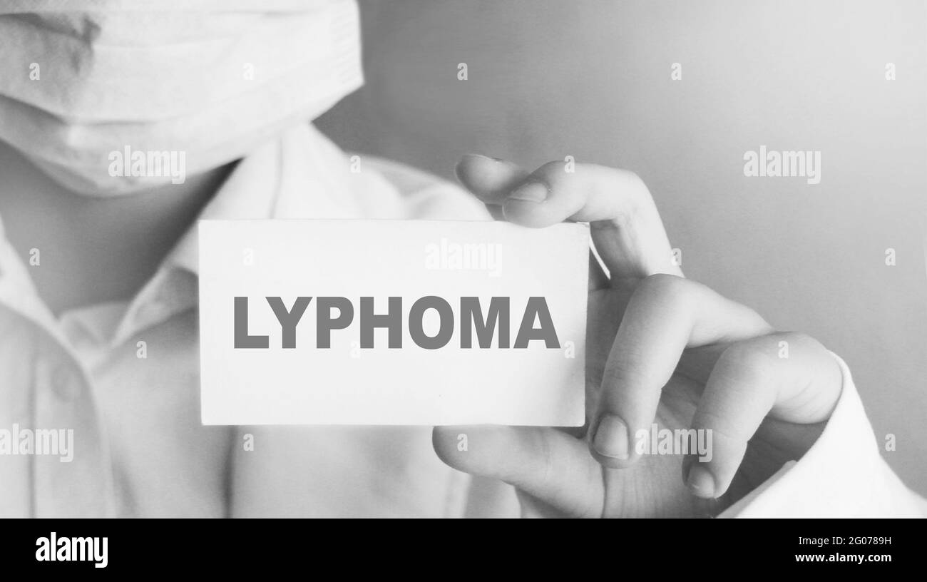 Doctor keeps a card with the name of the diagnosis lymphoma. Selective focus. Medical concept Stock Photo