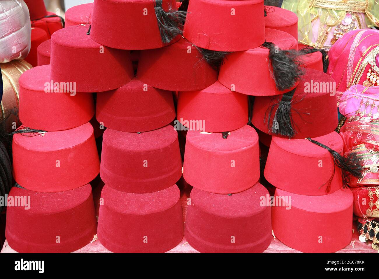 Several of the traditional fez hats for sale in the market stand of Istanbul. Stock Photo