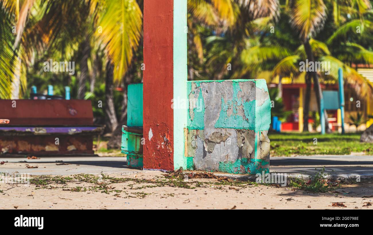 Colorful Concrete Ruins on tropical beach damaged from hurricane  Stock Photo