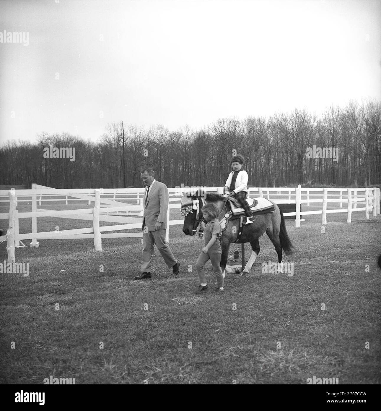 31 March 1963 Sally Fay riding horse "Macaroni" lead by Paul "Red" Fay