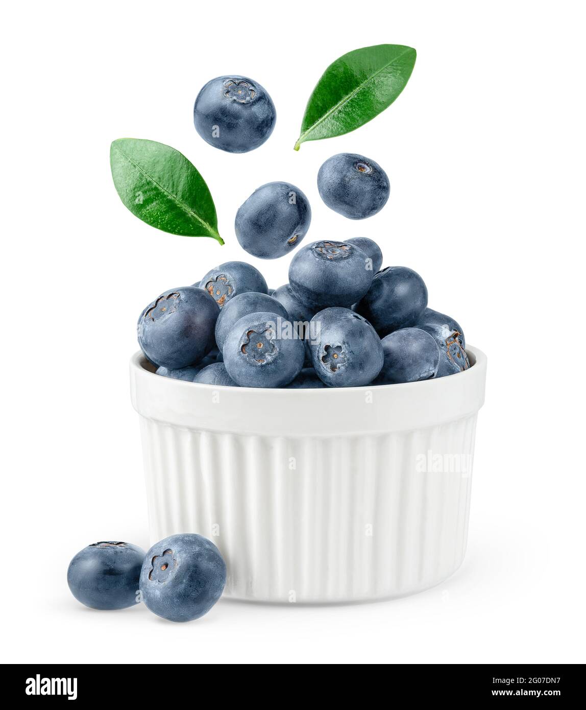 Blueberries flying over bowl isolated with clipping path on white background. Close up Stock Photo