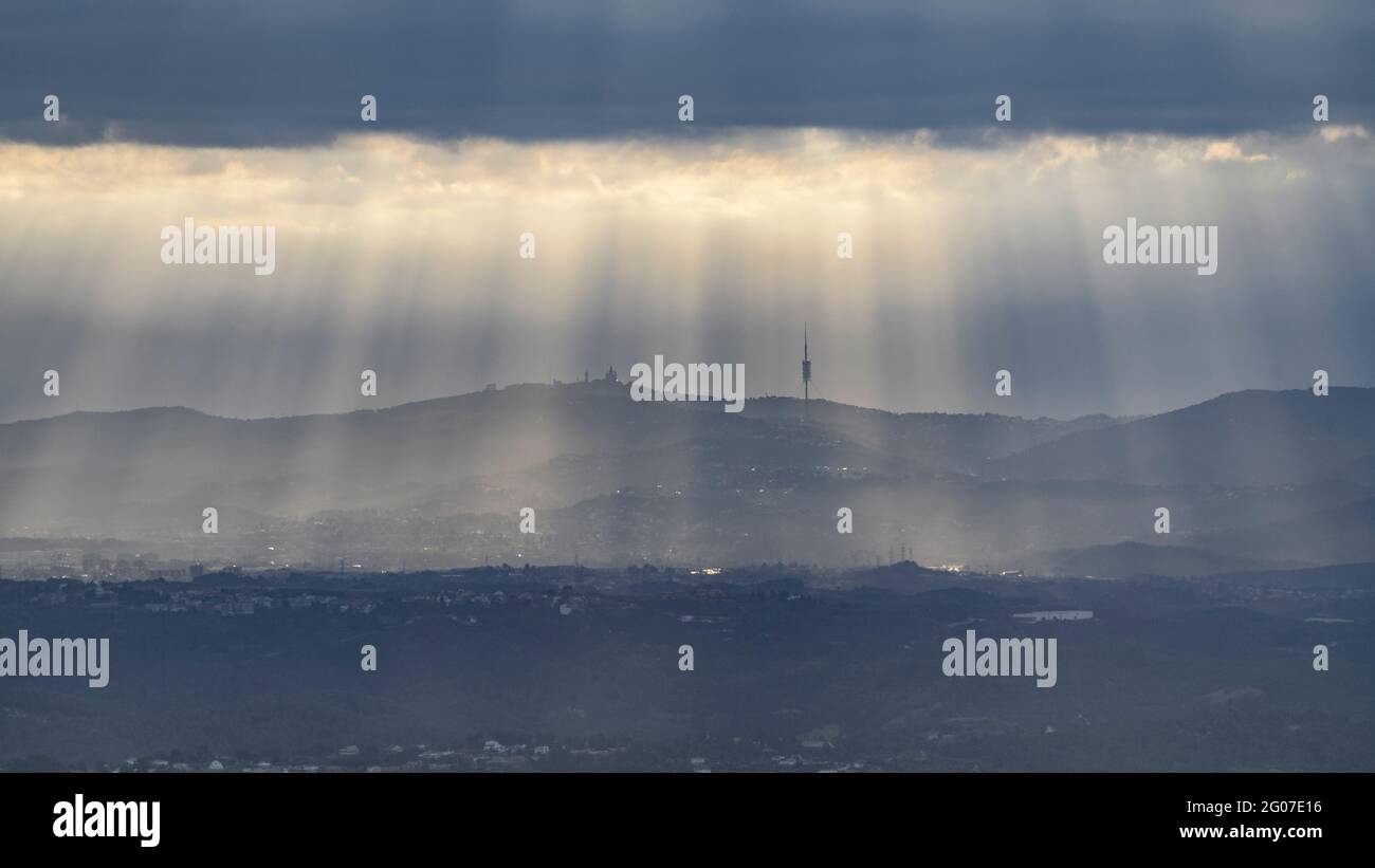 Rays of sunlight over the Collserola mountain range, seen from Montserrat (Barcelona, Catalonia, Spain) Stock Photo