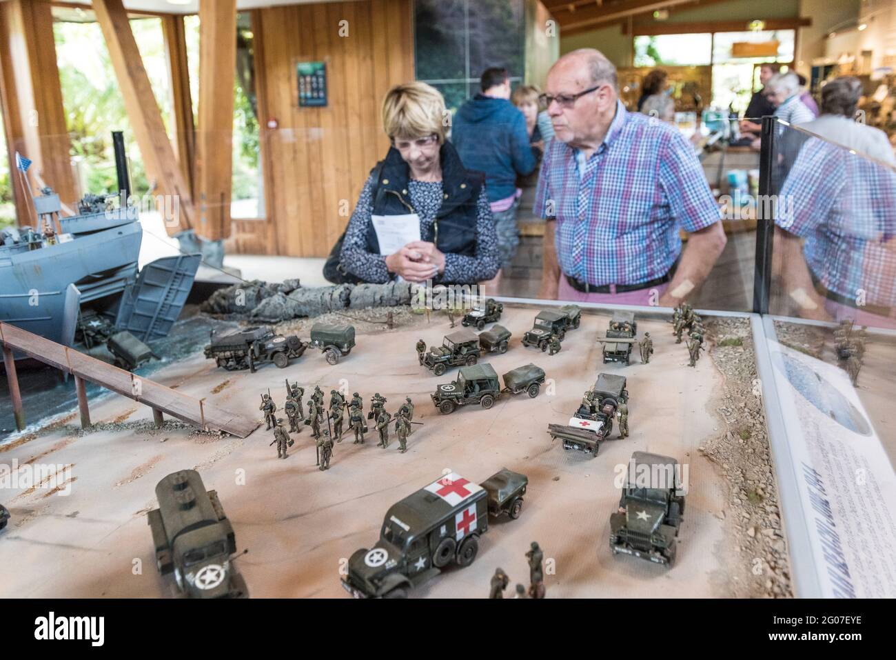 People looking at a diorama exhibit commemorating the 29th Infantry Division embarking from Trebah Garden Polgwidden Beach for the D-Day landings in W Stock Photo