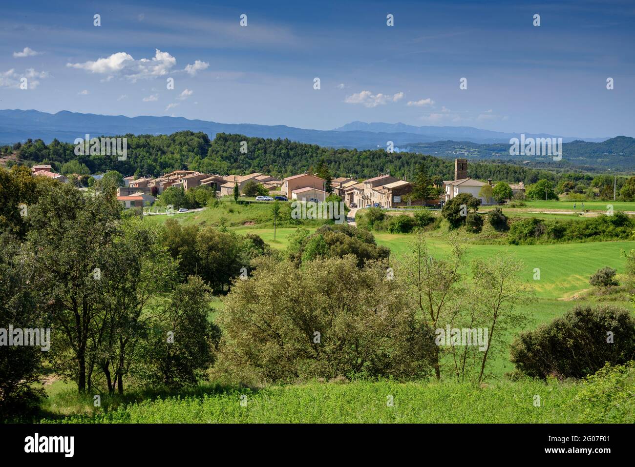 Santa Eulàlia de Puig-oriol Village in spring, surrounded by green meadows in the Lluçanès region (Osona, Barcelona, Catalonia, Spain) Stock Photo