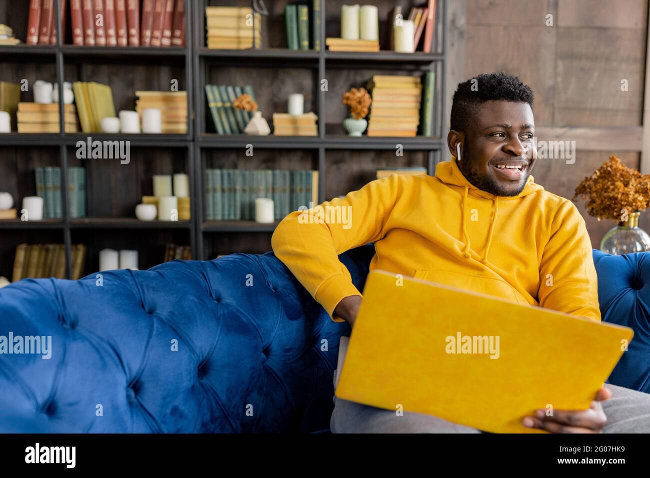 Close up smiling happy African American man wearing trendy yellow ...