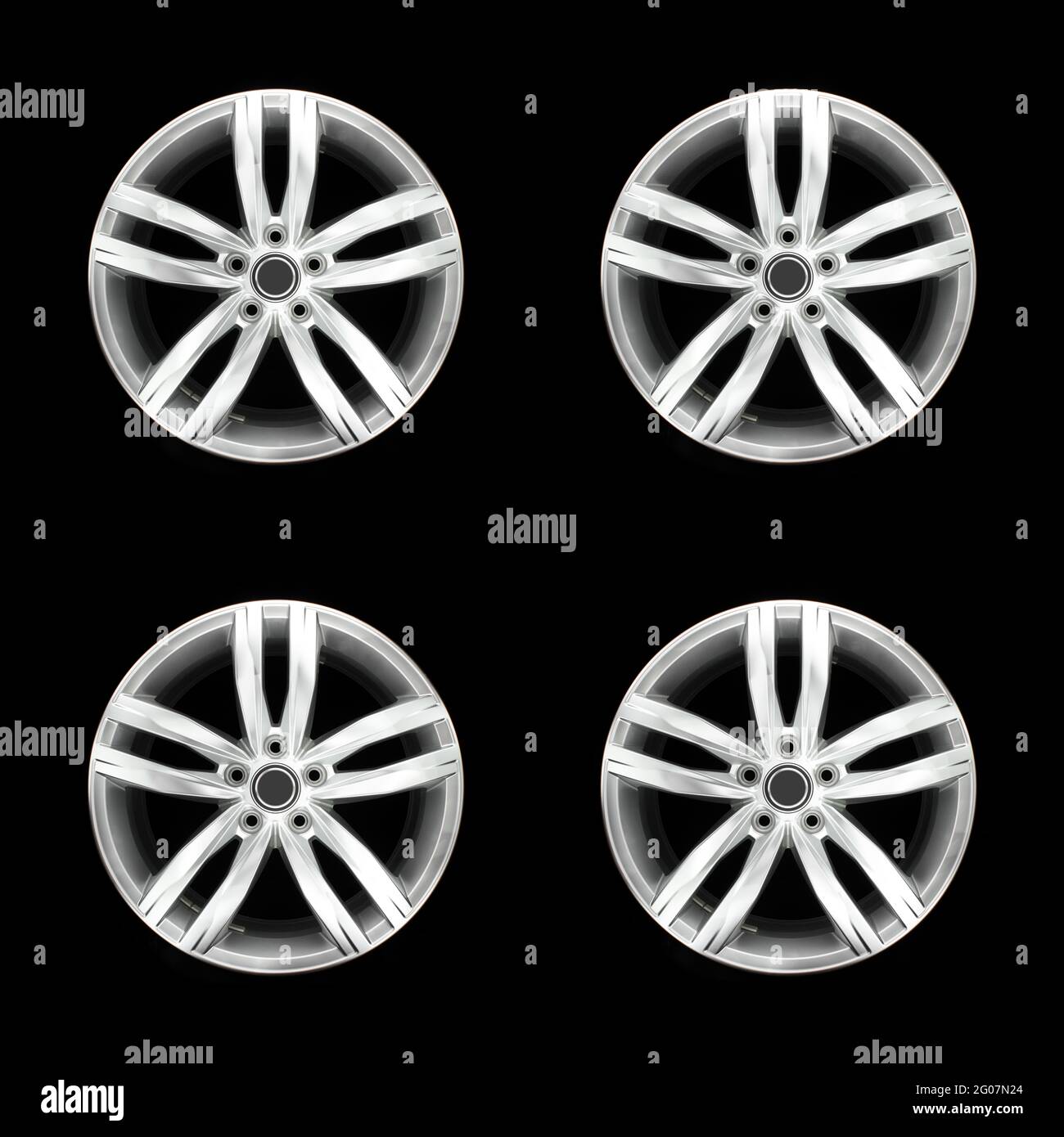 Set of four car rims. Aluminium car rims isolated on a black background