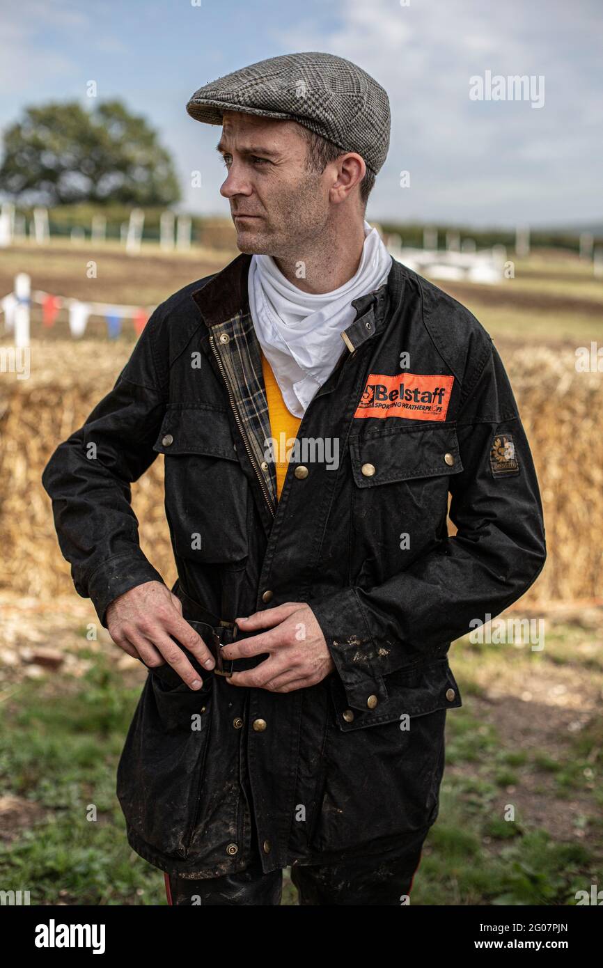 Man with flatcar and belstaff wax jacket at classic motorcycle scramblers  race in united kingdom Stock Photo - Alamy
