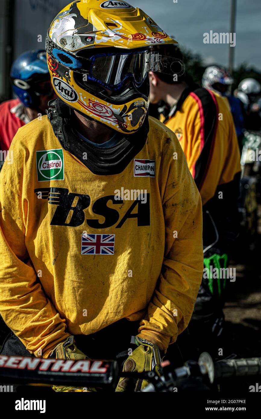 Man with motocross helmet at classic motorcycle scramblers race in