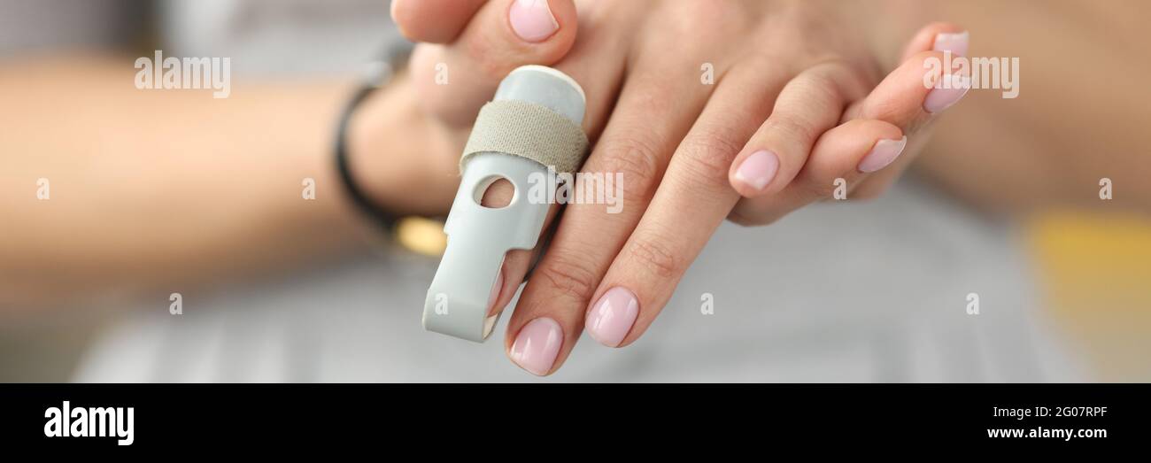 Orthopedic orthosis fixing joints of hand finger closeup Stock Photo
