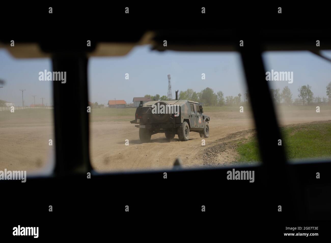 Smardan, Romania - May 11, 2021: Romanian Army Uro Vamtac armored vehicle seen from another armored vehicle, in Smardan firing range. Stock Photo