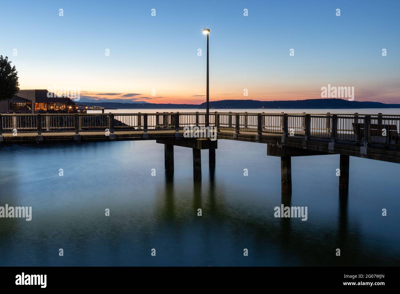 Street Light on Dock Over Water During Blue Hour Stock Photo
