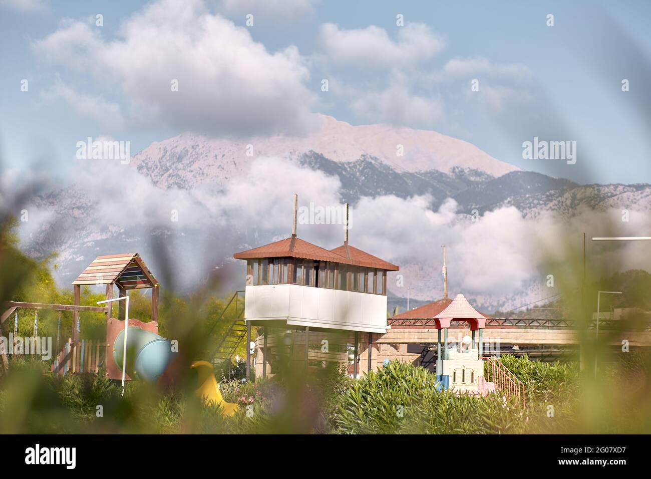 Mountain urban view. Turkish beach with city infrastructure and beautiful huge mountains. Copy space. High quality photo Stock Photo