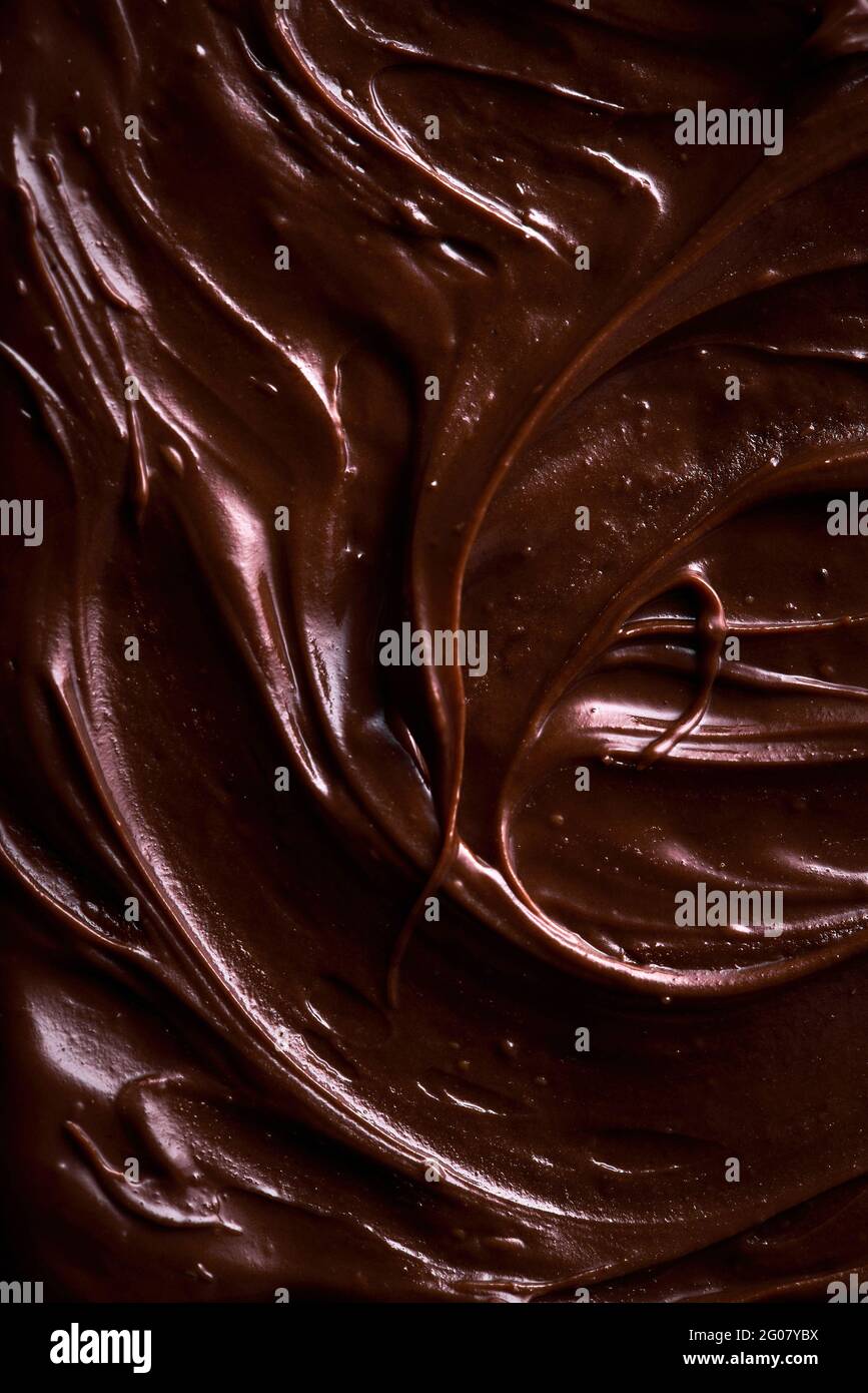 From above background with tempting brown chocolate-flavored paste for spreading on bread Stock Photo