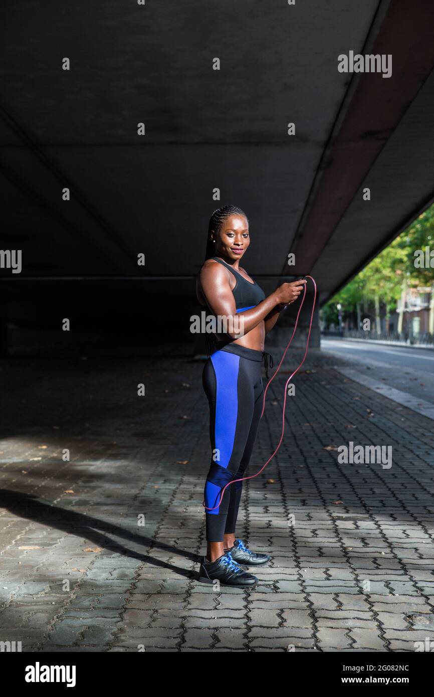 Foto Stock Black woman, jump and fitness while workout, exercise