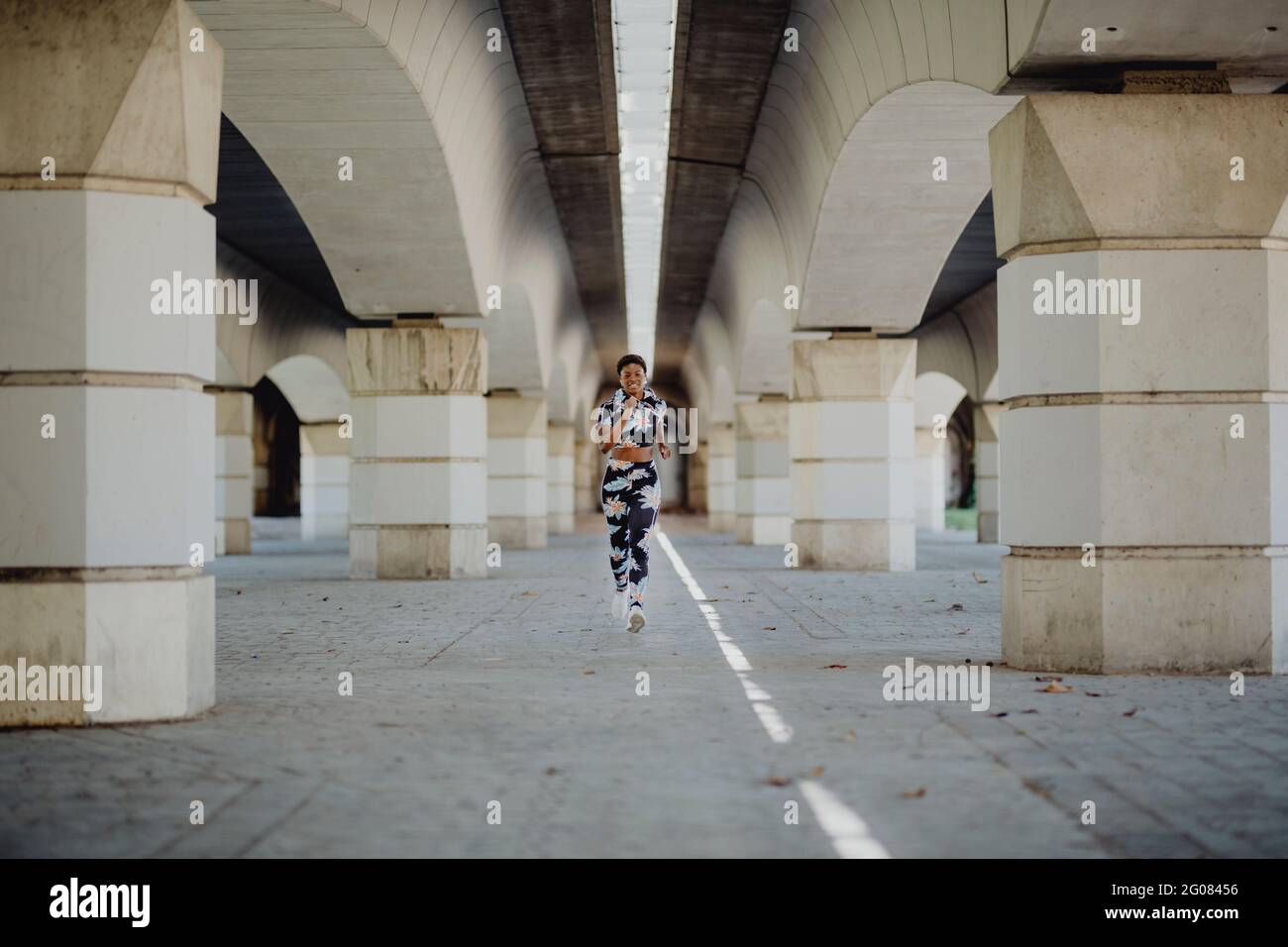 African american woman running hi-res stock photography and images - Alamy