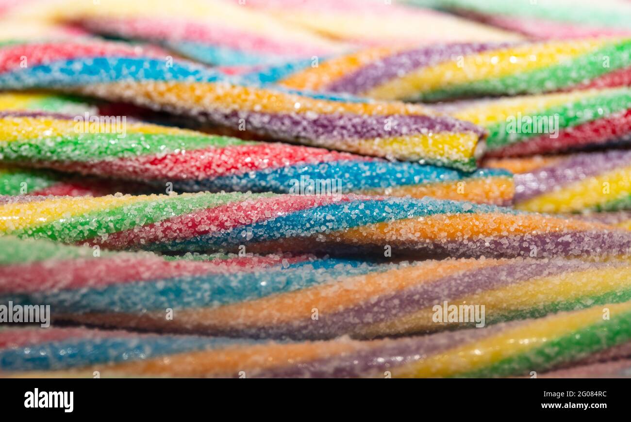 Multicolored jelly stick candies textured background Stock Photo