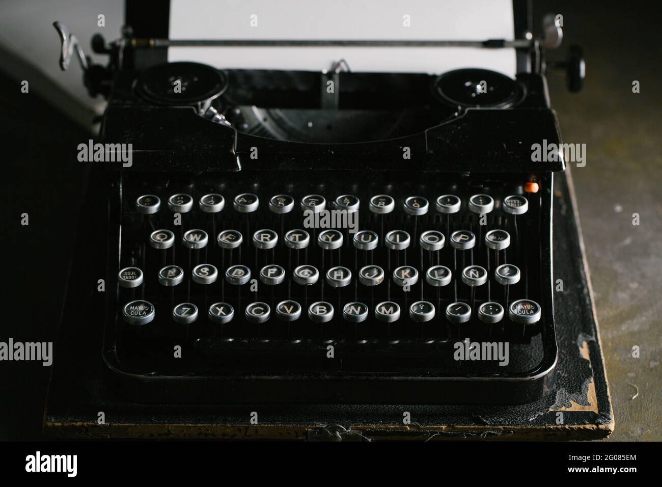 Retro vintage typewriter standing on old wooden table Stock Photo