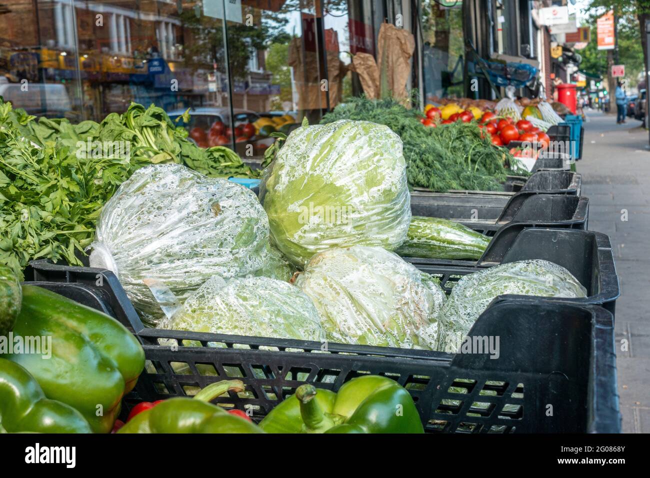 Fresh fruit and vegetables in baskets outside a greengrocers shop in