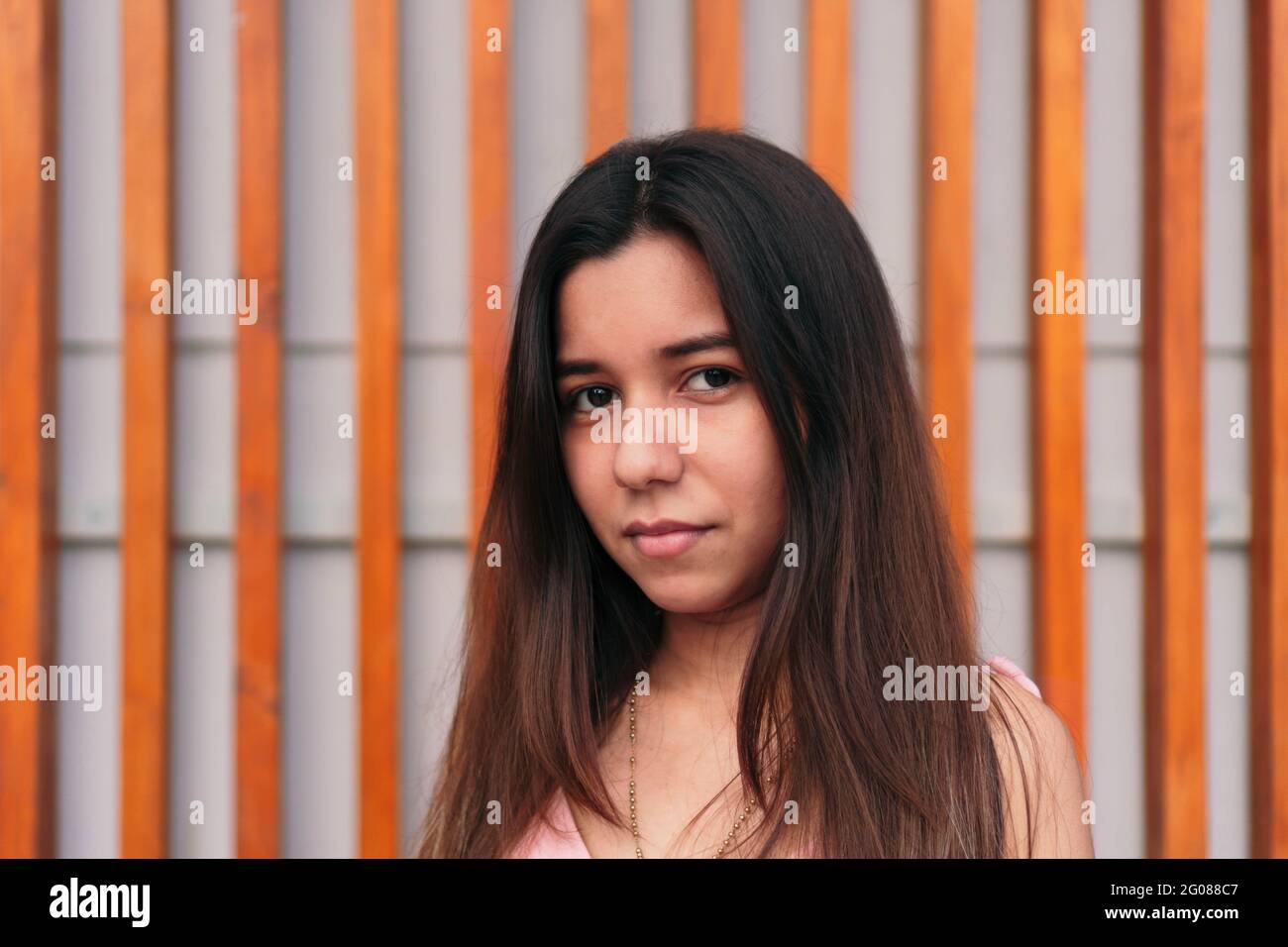 close-up-portrait-of-a-beautiful-young-latina-serious-and-looking-at