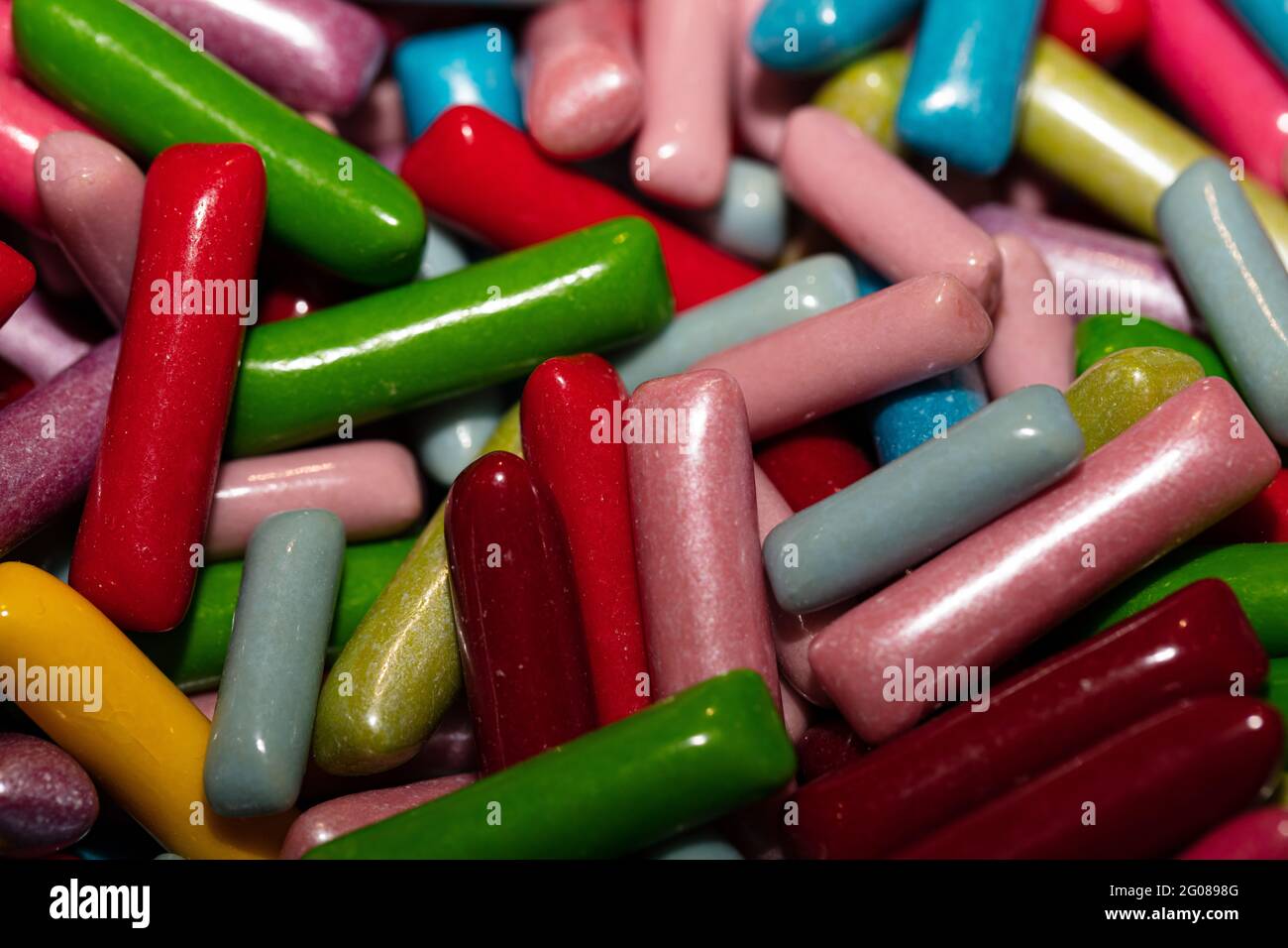 Multicolored jelly stick candies textured background Stock Photo