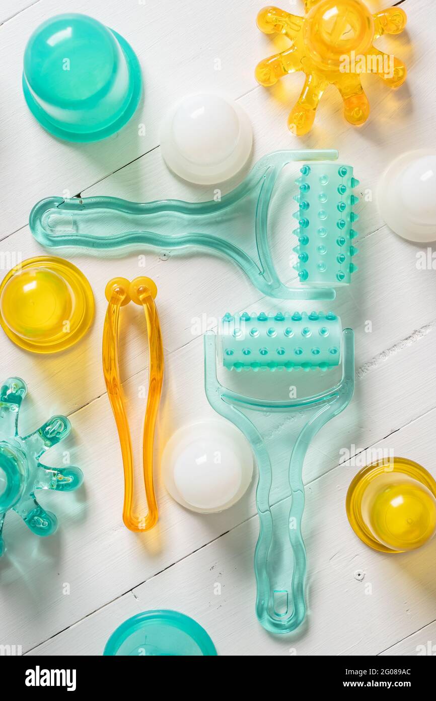 top view of plastic massage tools roller and accessories on bright background Stock Photo