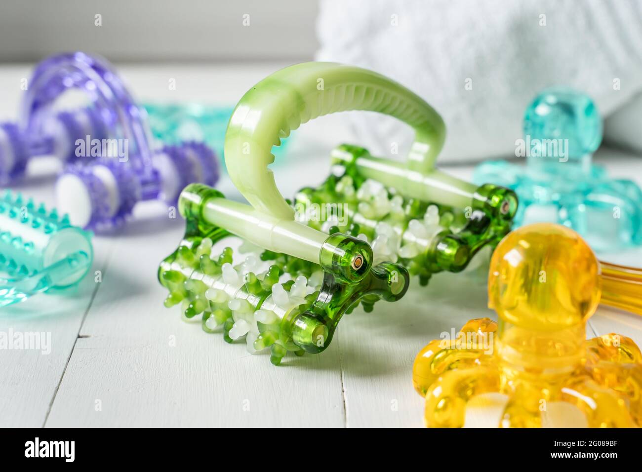 Close up of plastic massage tools roller and accessories on bright background Stock Photo