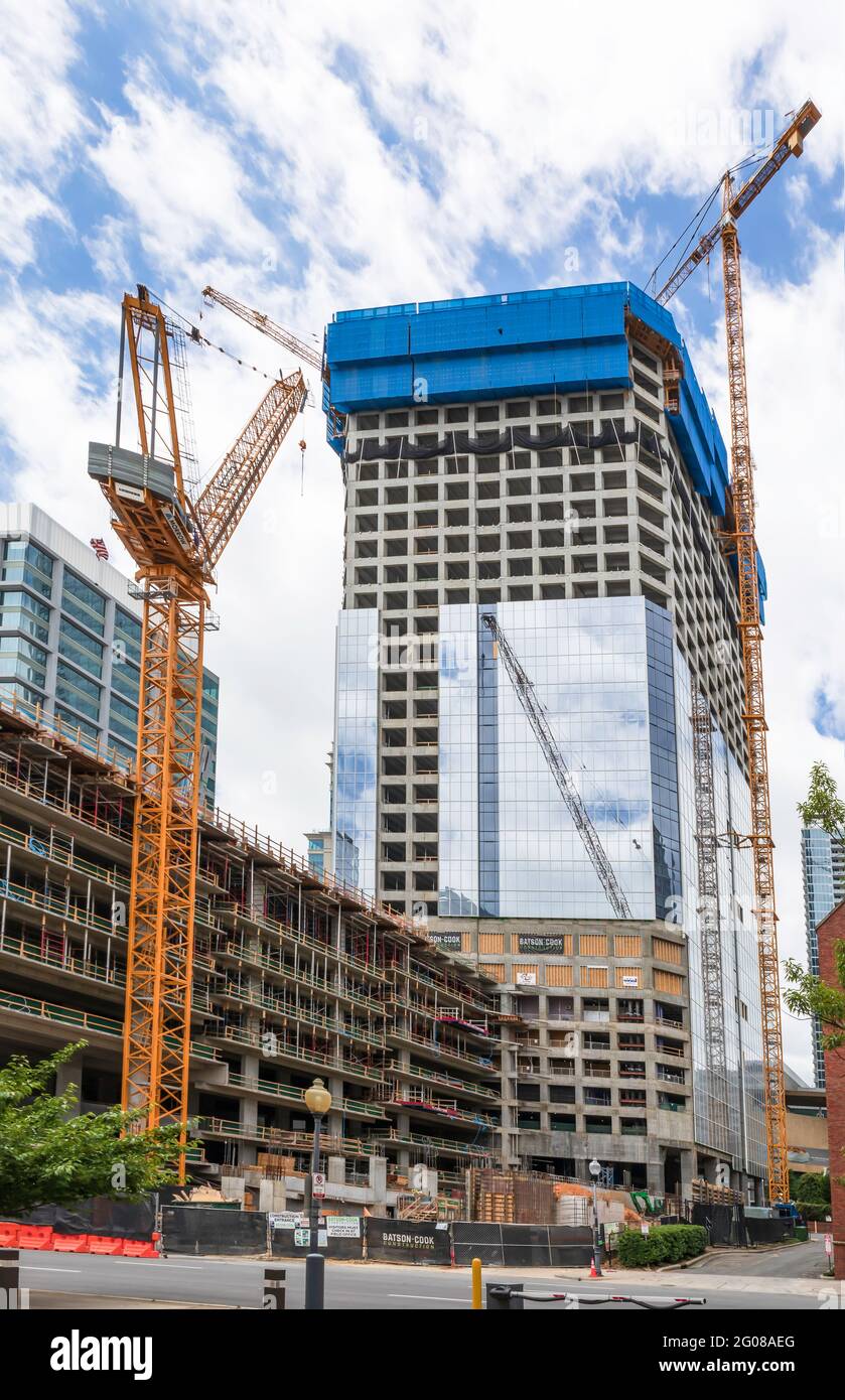 CHARLOTTE, NC, USA-30 MAY 2021: New skyscraper construction in center city with 3 cranes. Stock Photo