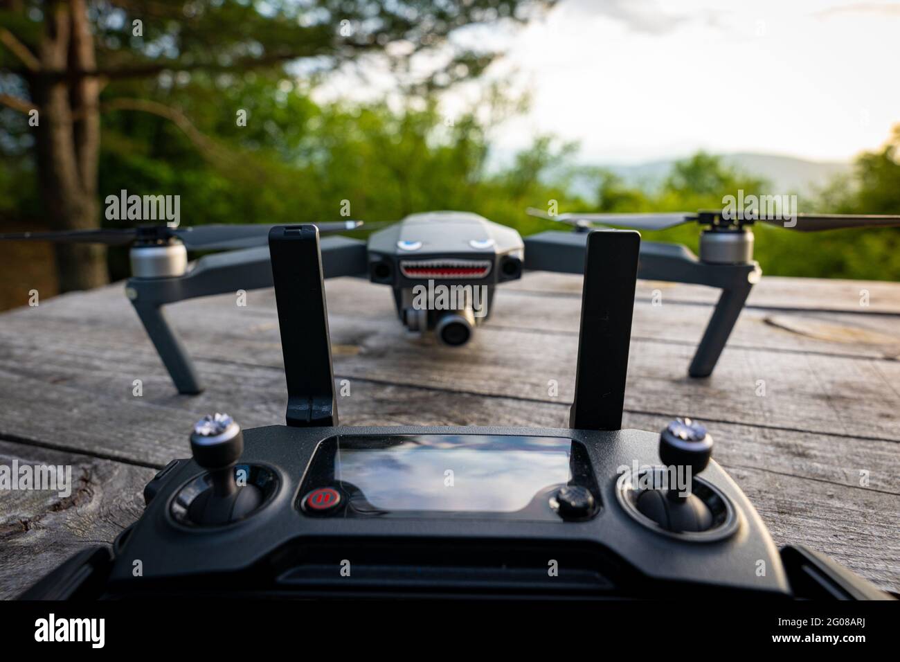 DJI Mavic Pro controller with the drone in the background Stock Photo