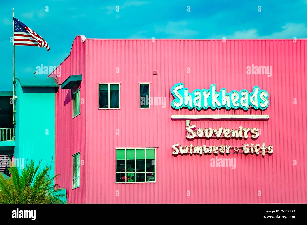 An American flag flies in front of Sharkheads souvenir shop, May 29, 2021, in Biloxi, Mississippi. Stock Photo