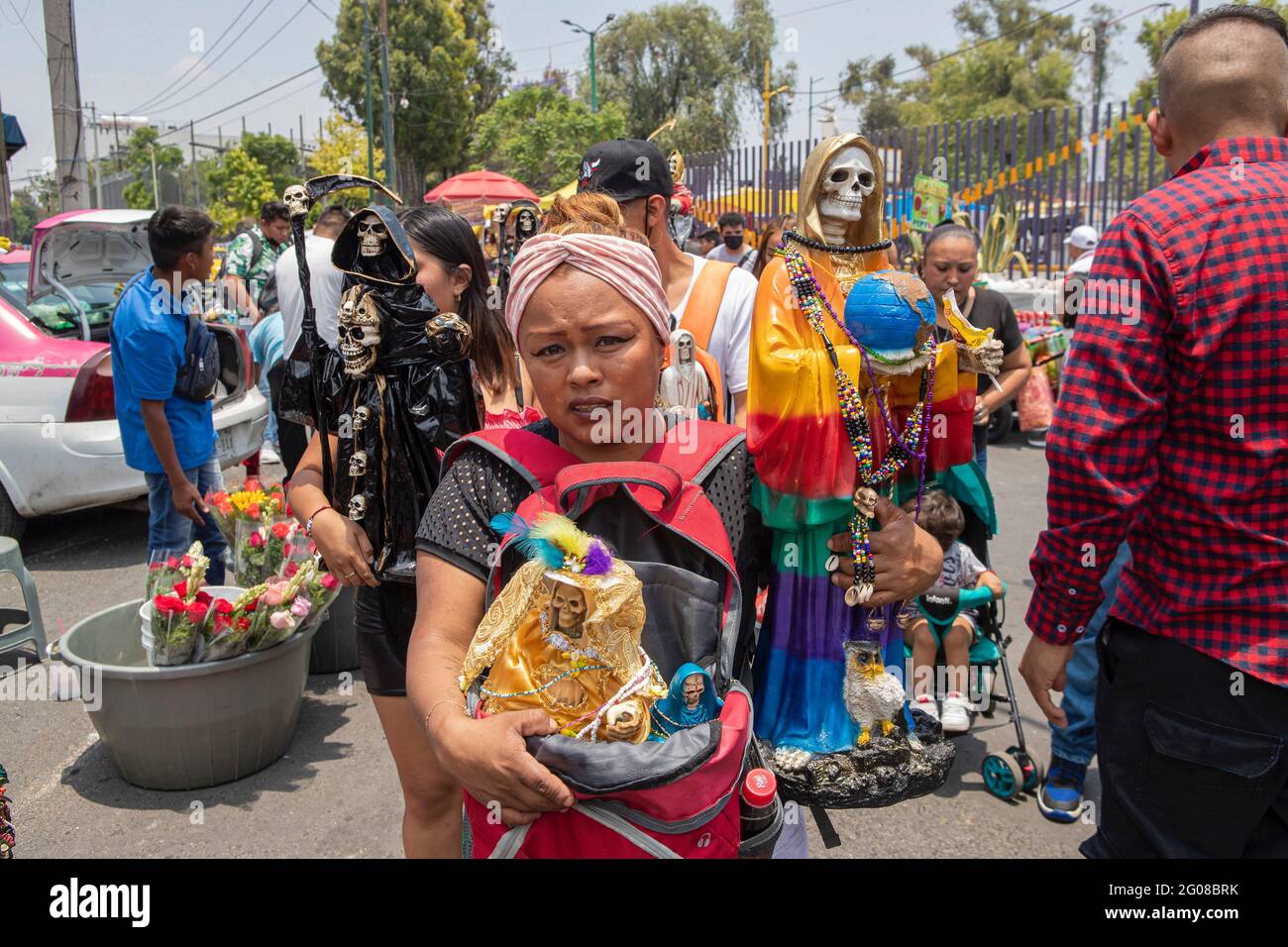 June 1, 2021, Mexico City, Mexico City, Mexico: A faithful holds a statue of Santa Muerte, while arriving at the Altar of Santa Muerte in the town of Tepito, as part of the celebrations that held on the first day of each month, hundreds of devotees attend to venerate it, give thanks for the favors and the fulfilled promises that this deity has granted them. La Santa Muerte or Santisima Muerte is a popular Mexican figure who personifies death and is an object of worship, the devotees of her are usually perceived as people associated with crime, gang activity, prostitution, drug trafficking. On Stock Photo