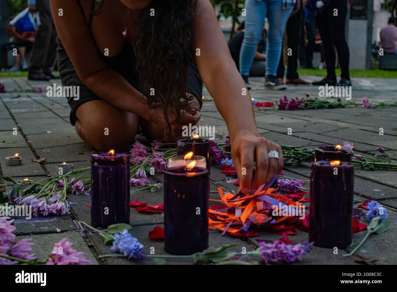 Medellin, Colombia. May 31, 2021 Groups of feminists participate in a Vigil for the lives of the demonstrators during the anti-government protests that leaves at least 70 dead in the first month of protests against the government of president Ivan Duque and Police Brutality on May 31, 2021 in Medellin, Colombia. Stock Photo