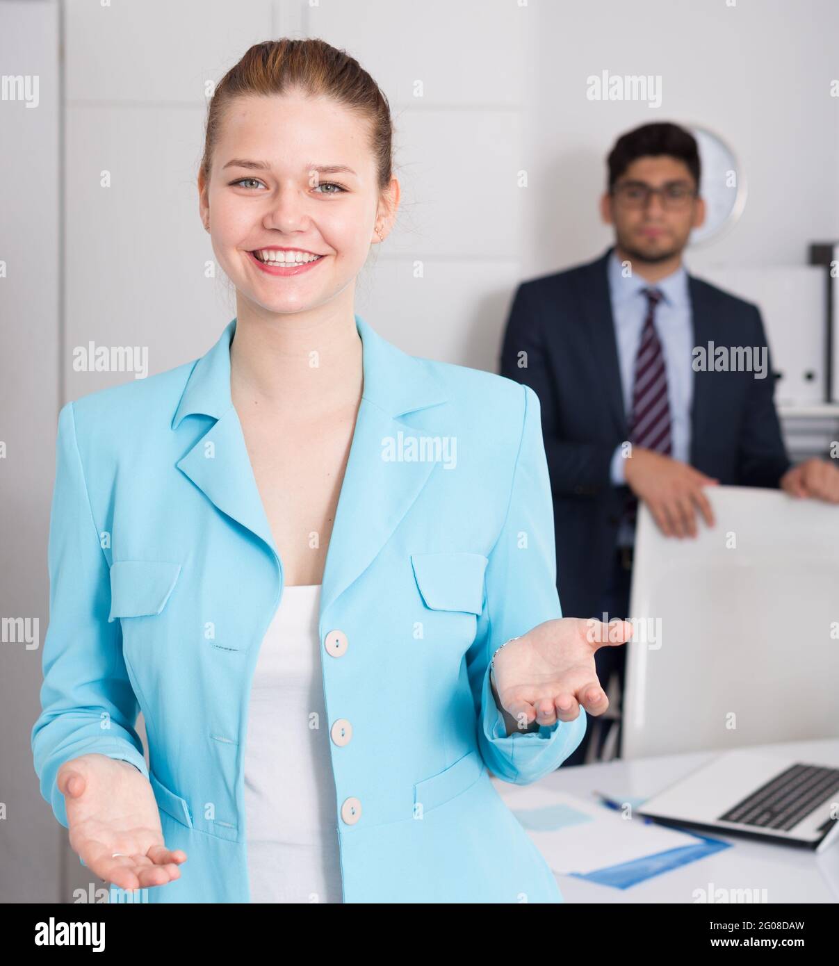 Businesswoman welcoming to company office Stock Photo - Alamy