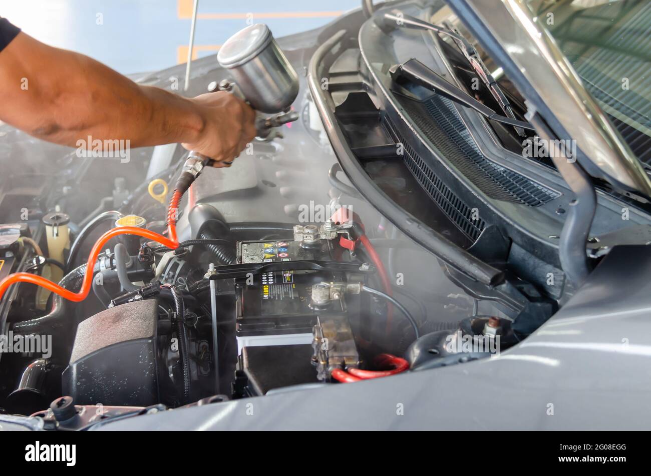 Clean the engine after washing the engine. Spraying the engine room varnish Stock Photo