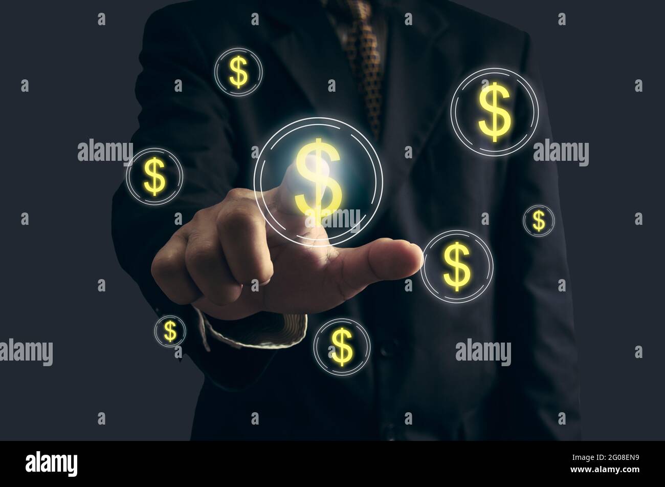 Business man hand is pointing or pressing button with dollar financial icon symbol on virtual screen. Business concept and  technology digital Stock Photo