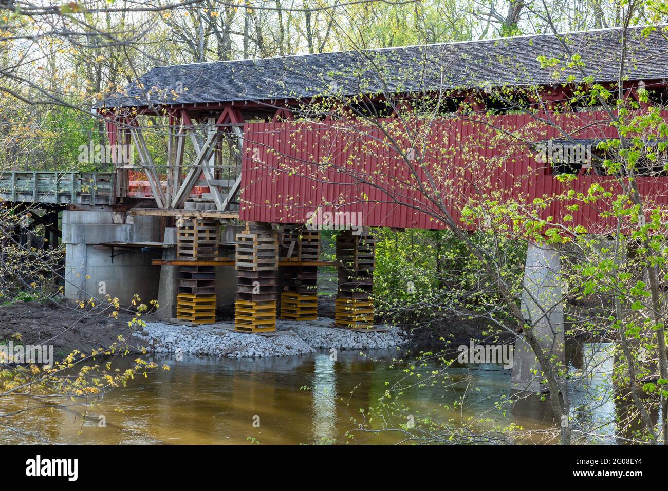 The 1873 Spencerville Covered Bridge, closed for rehabilitation, spans the St. Joseph River at Spencerville, Indiana, USA. Stock Photo