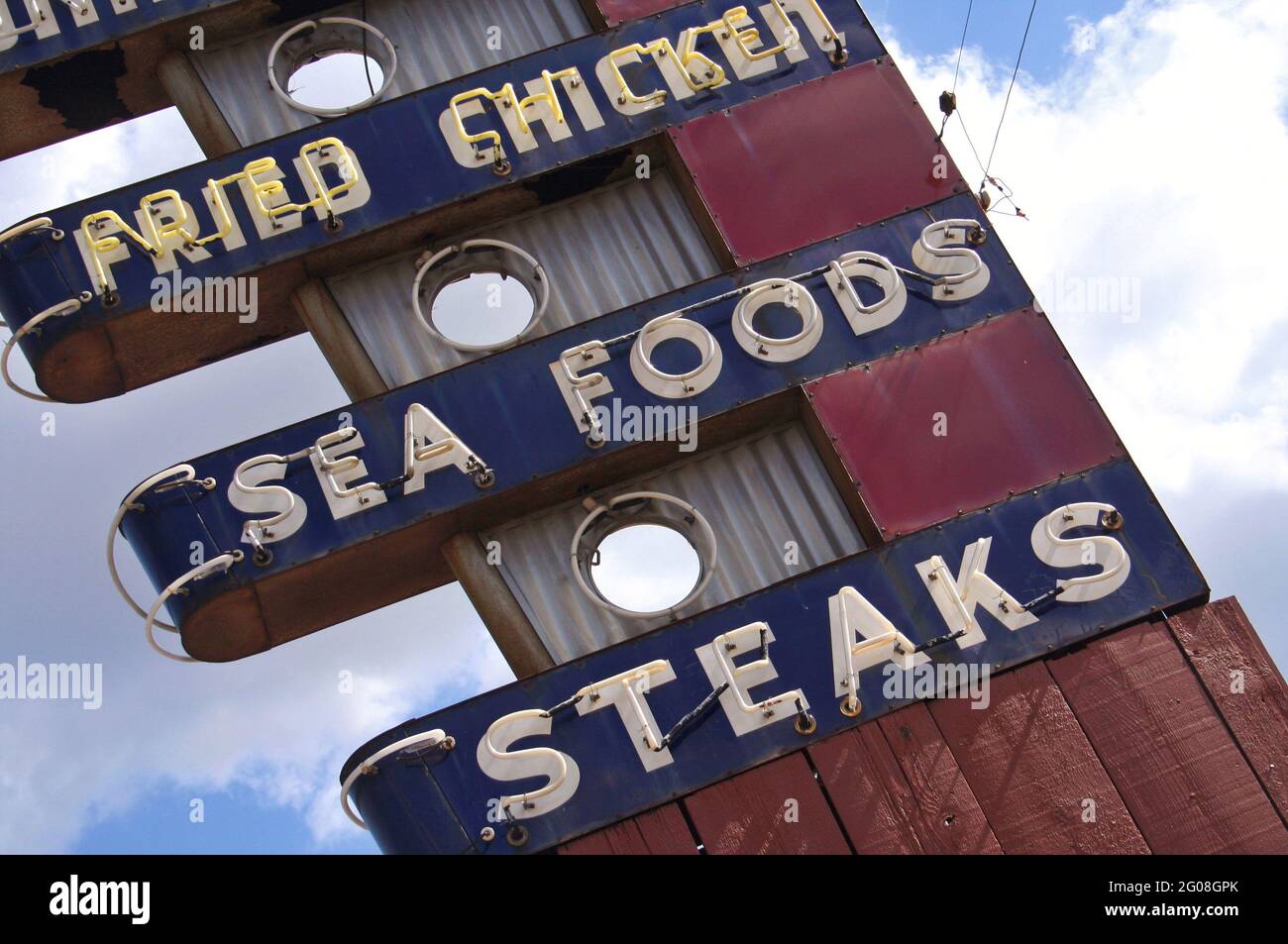 Restaurant Sign on Building Roof Stock Photo
