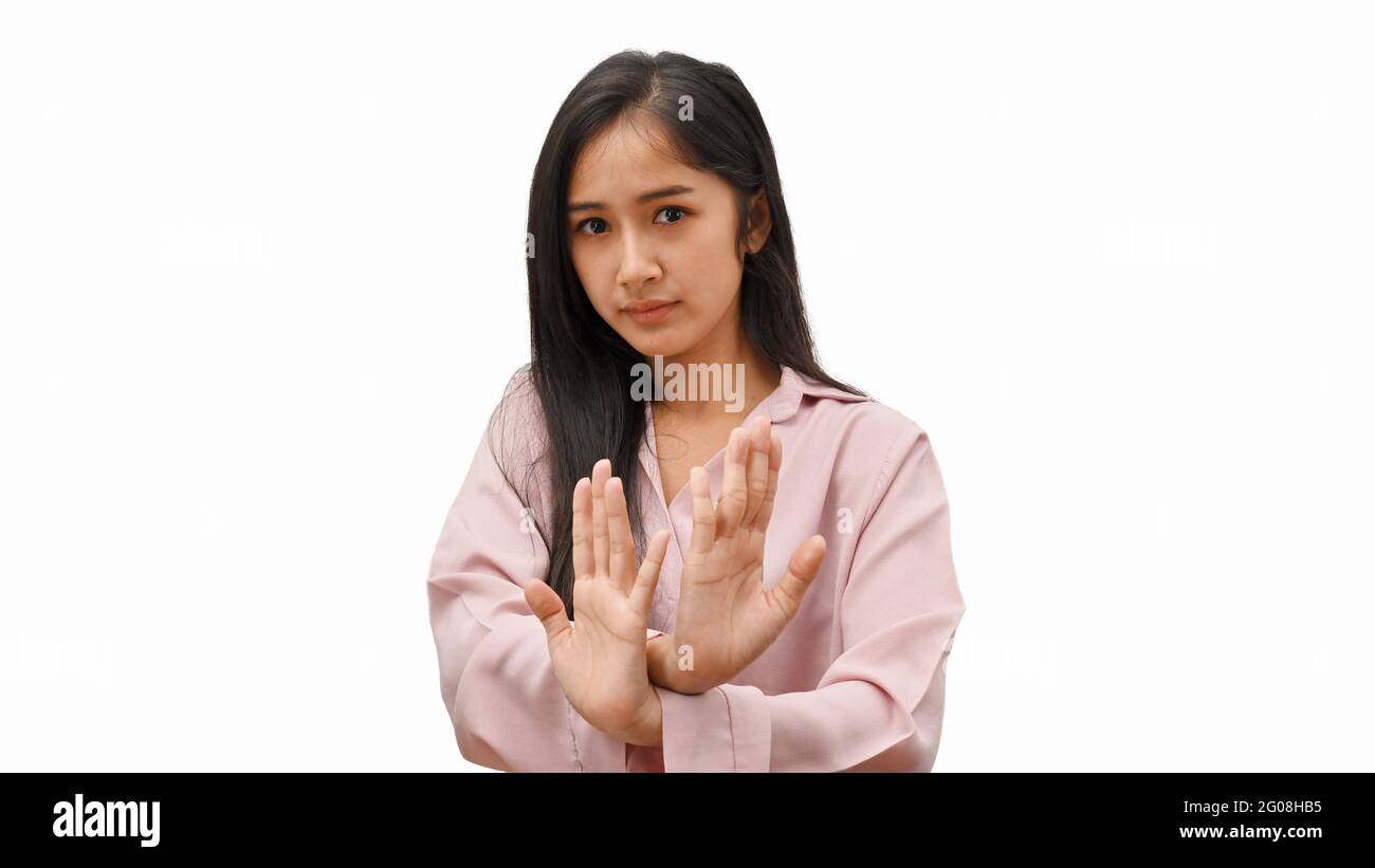 Half-length portrait of young female gesturing rejection sign isolated ...