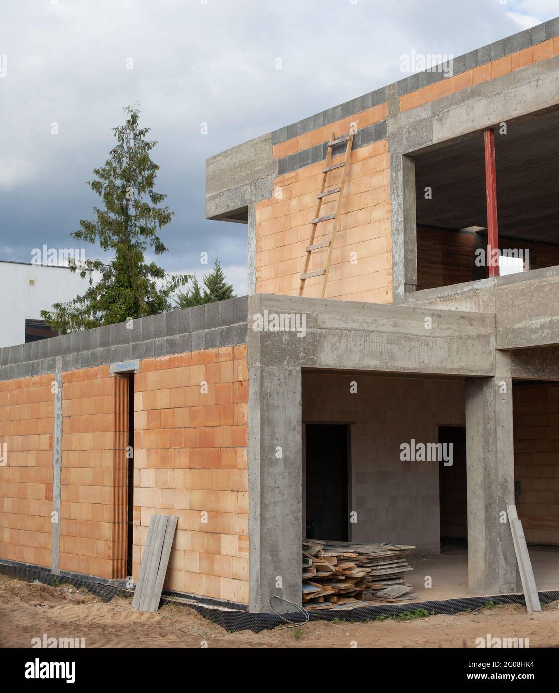 Vertical shot of a newly constructed building under a cloudy sky Stock ...
