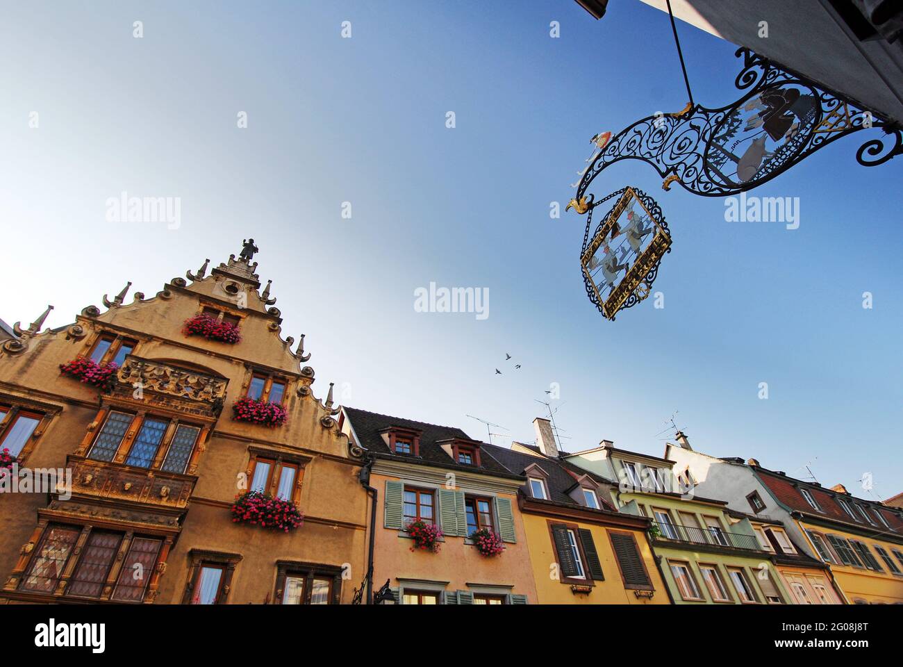 FRANCE, HAUT-RHIN (68), COLMAR, STREET HEADS, HEADS HOUSE AND SIGNBOARD CHARCUTERIE AUX DEUX FRERES Stock Photo