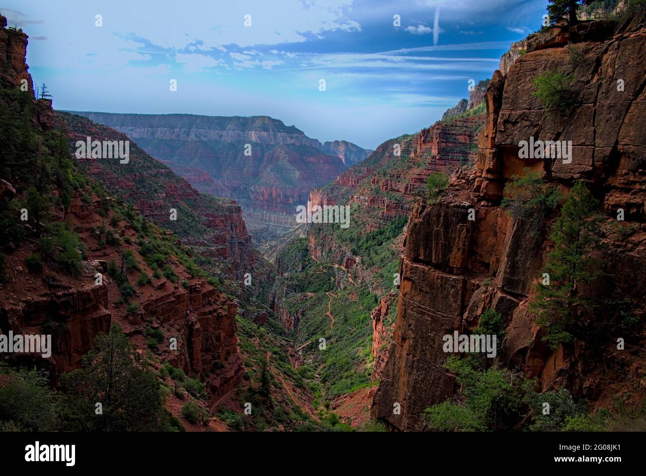 View from North rim grand canyon north kaibab trail descending switchbacks down steep terrain to reach phantom ranch at bottom. Stock Photo
