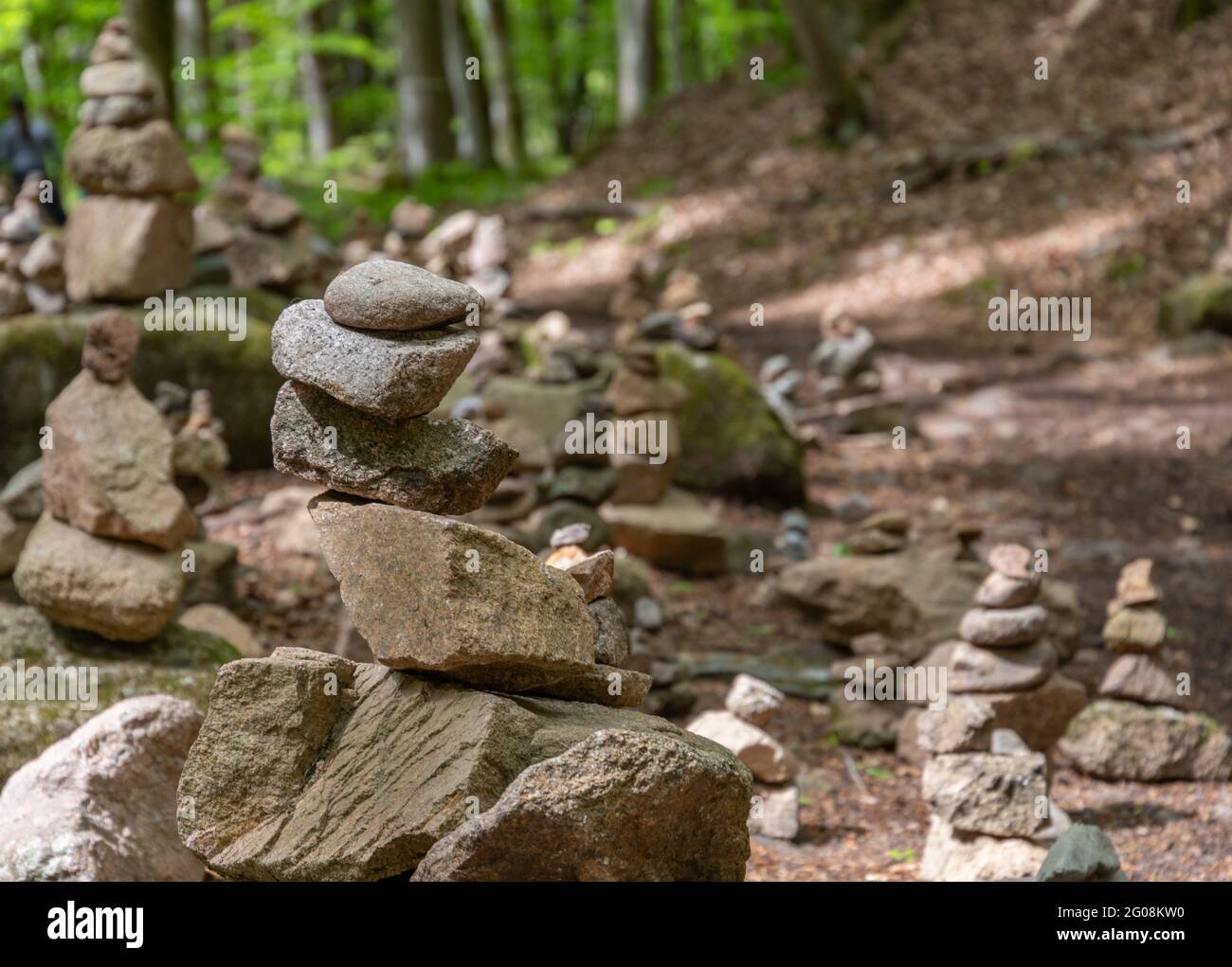 stack of stones in a forest at Harz nationalpark in Germany as a sign for a hiking trail Stock Photo