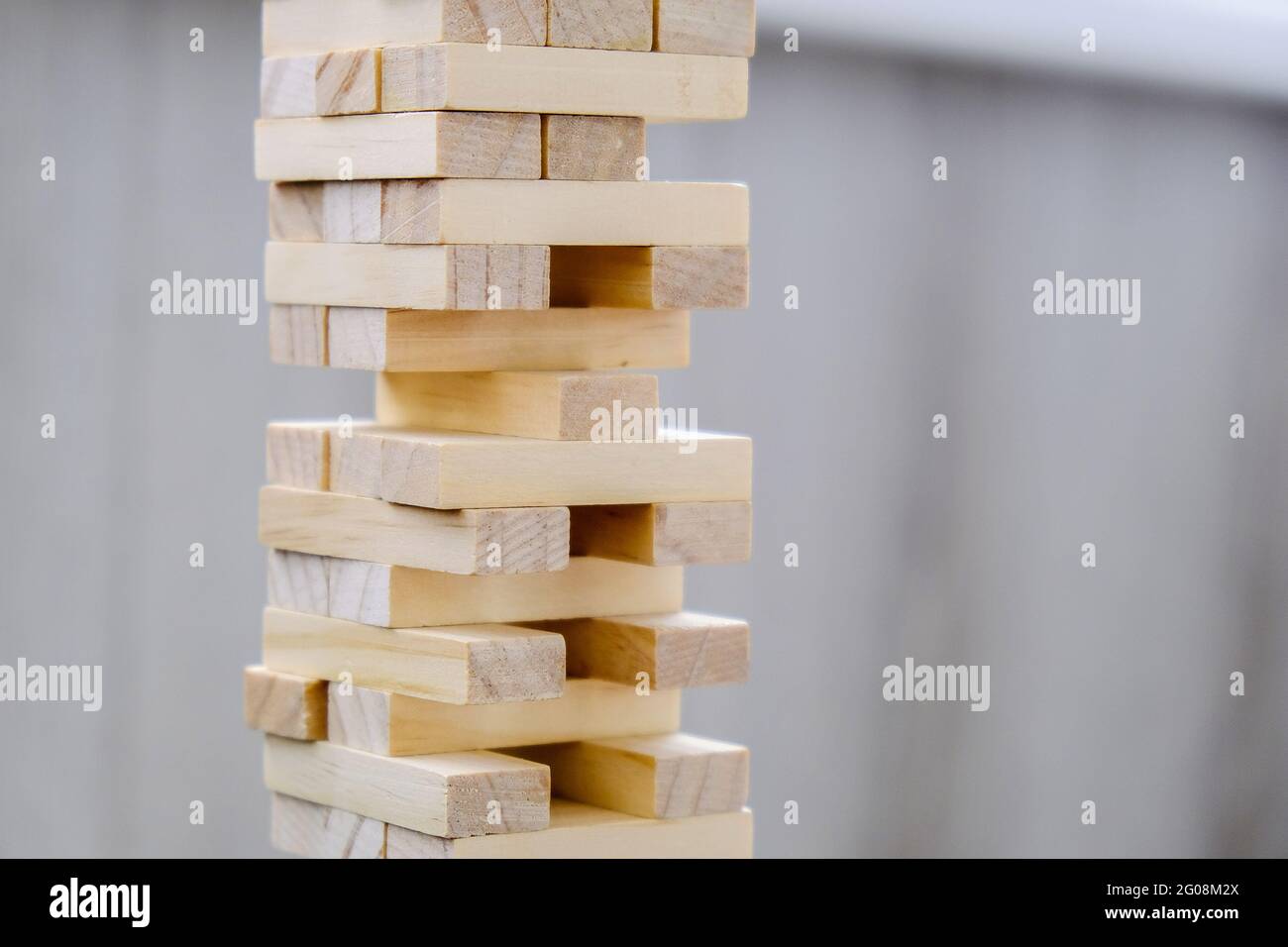 Building from wooden blocks. Wood blocks stack game with Hand on ...