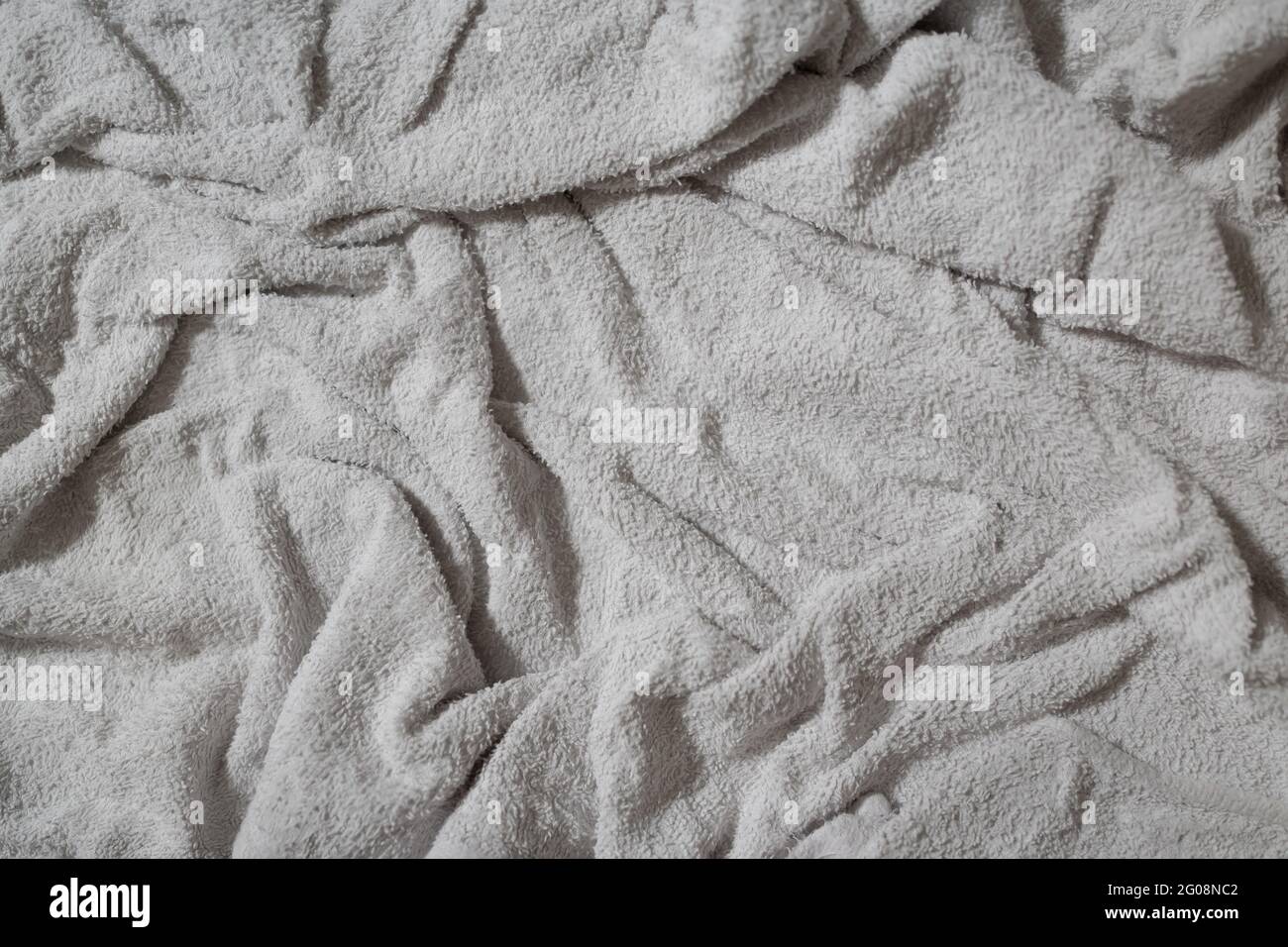 Crumpled white towel texture background Stock Photo