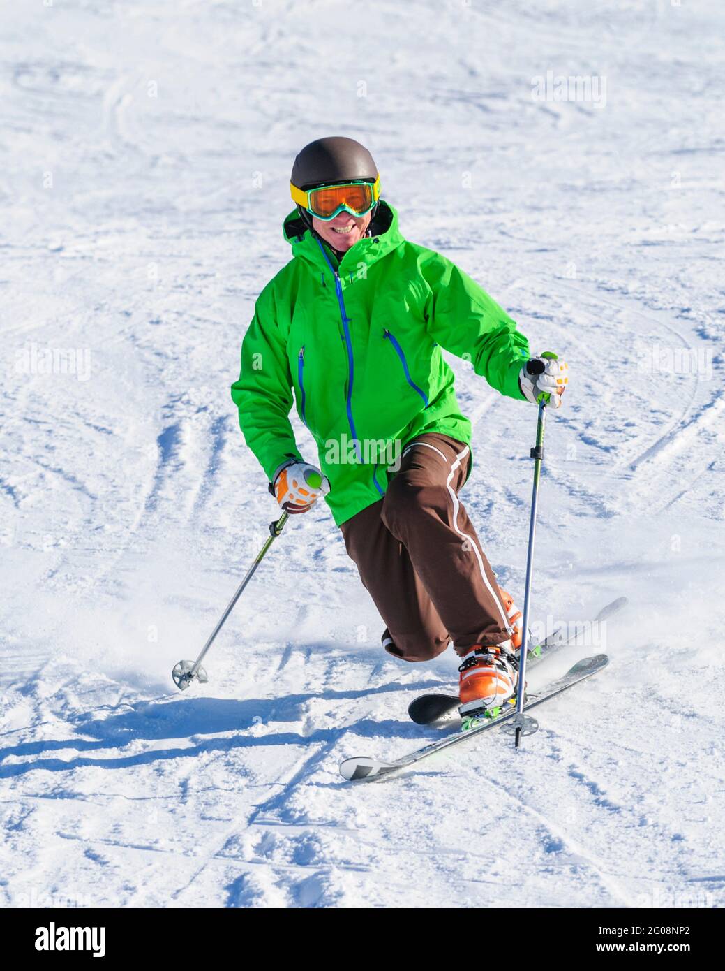 Sporty telemark skier has fun on perfect slope Stock Photo