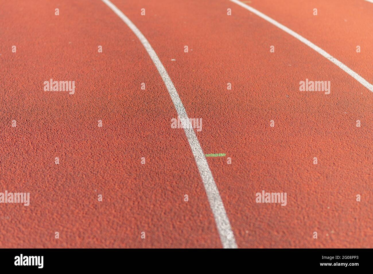Part Red plastic track in the outdoor track and field stadium.Closeup. Stock Photo